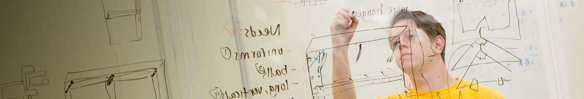 student writing on whiteboard